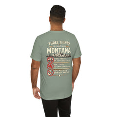 Montana Rules Tee - “3 Things You Don’t Do in Montana: Don’t Pet the Buffalo, Outdrink Canadians, Mess with Cowboy Music”