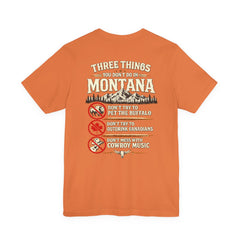 Montana Rules Tee - “3 Things You Don’t Do in Montana: Don’t Pet the Buffalo, Outdrink Canadians, Mess with Cowboy Music”