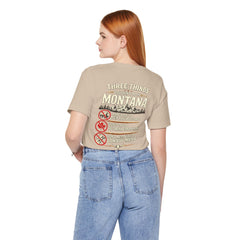 Montana Rules Tee - “3 Things You Don’t Do in Montana: Don’t Pet the Buffalo, Outdrink Canadians, Mess with Cowboy Music”