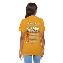 Montana Rules Tee - “3 Things You Don’t Do in Montana: Don’t Pet the Buffalo, Outdrink Canadians, Mess with Cowboy Music”
